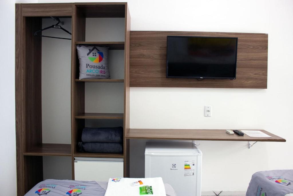 TV a/nebo společenská místnost v ubytování Pousada Arco Iris Fortaleza
