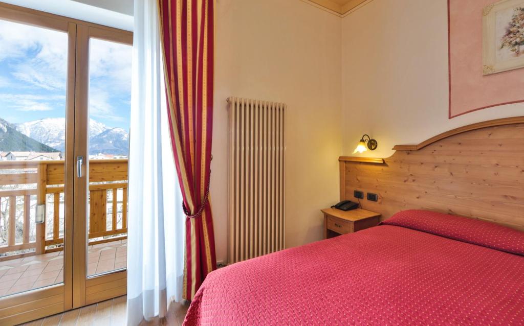 Łóżko lub łóżka w pokoju w obiekcie Hotel Fai