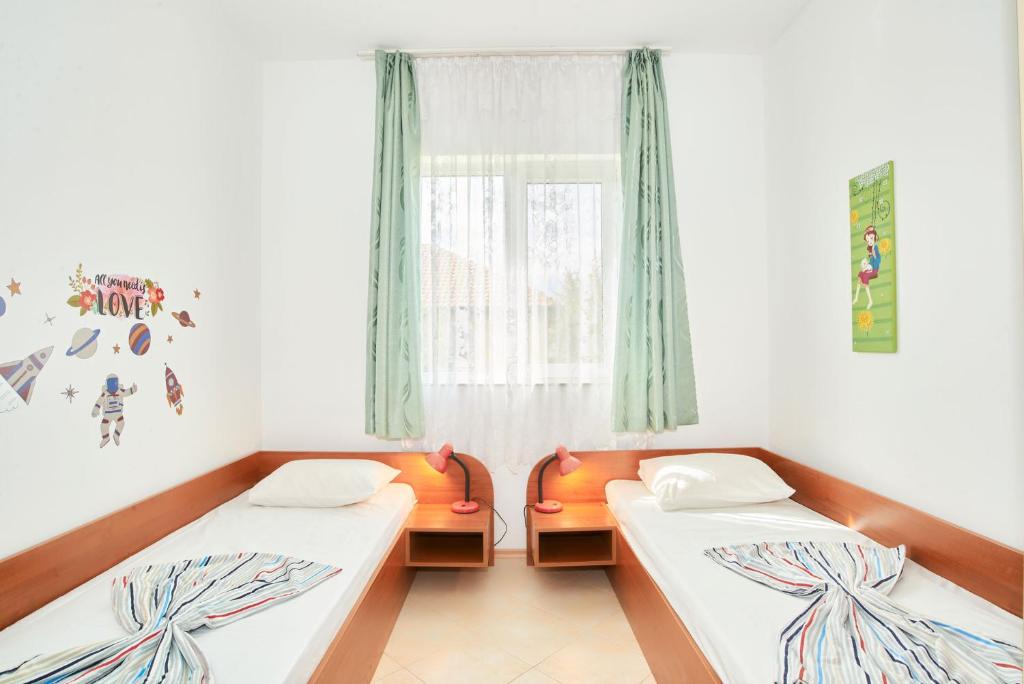 Postel nebo postele na pokoji v ubytování BulgariaVilla - Villa Gardenia