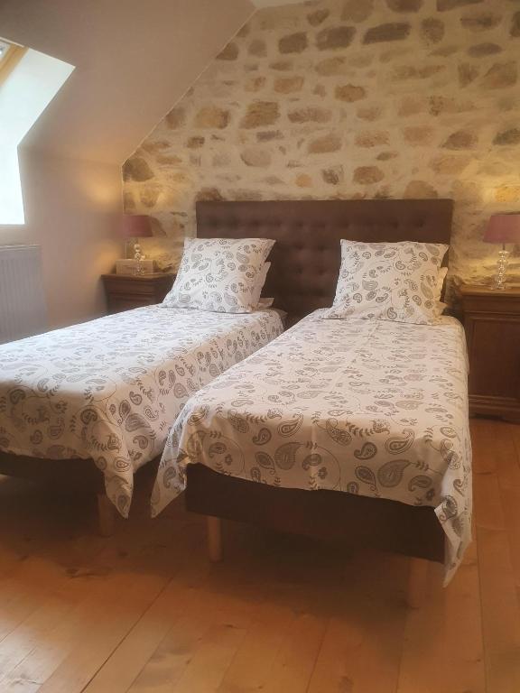 Postel nebo postele na pokoji v ubytování Graine de Reves