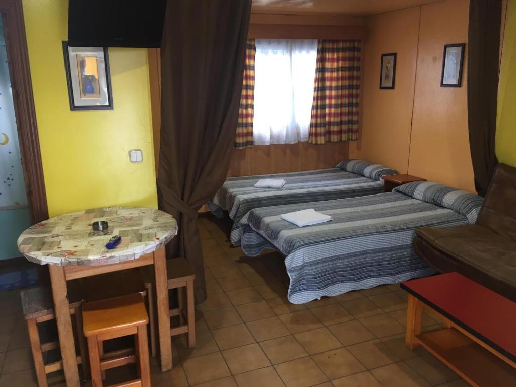 Postel nebo postele na pokoji v ubytování Bungalows Alpha