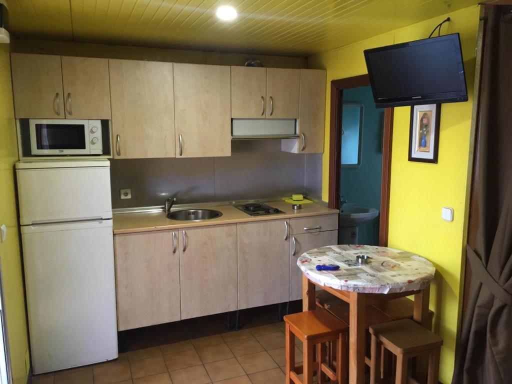 Kuchyň nebo kuchyňský kout v ubytování Bungalows Alpha