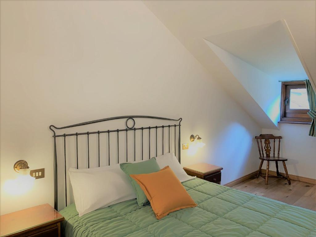 Кровать или кровати в номере Hotel Serena Cortina