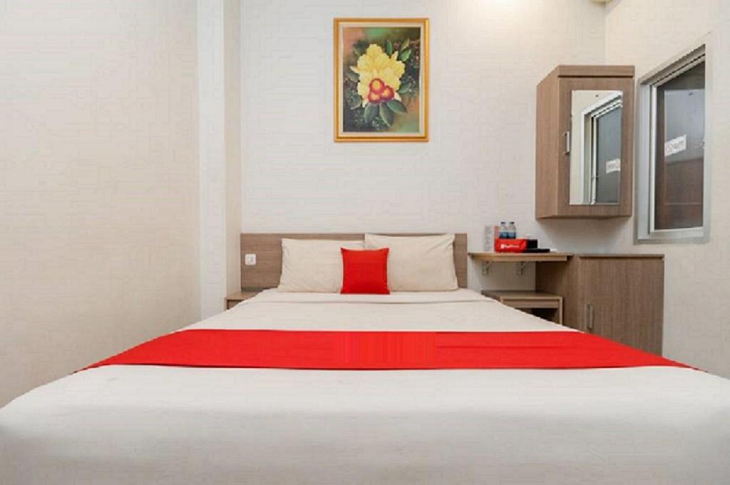 Postel nebo postele na pokoji v ubytování Hotel Domino