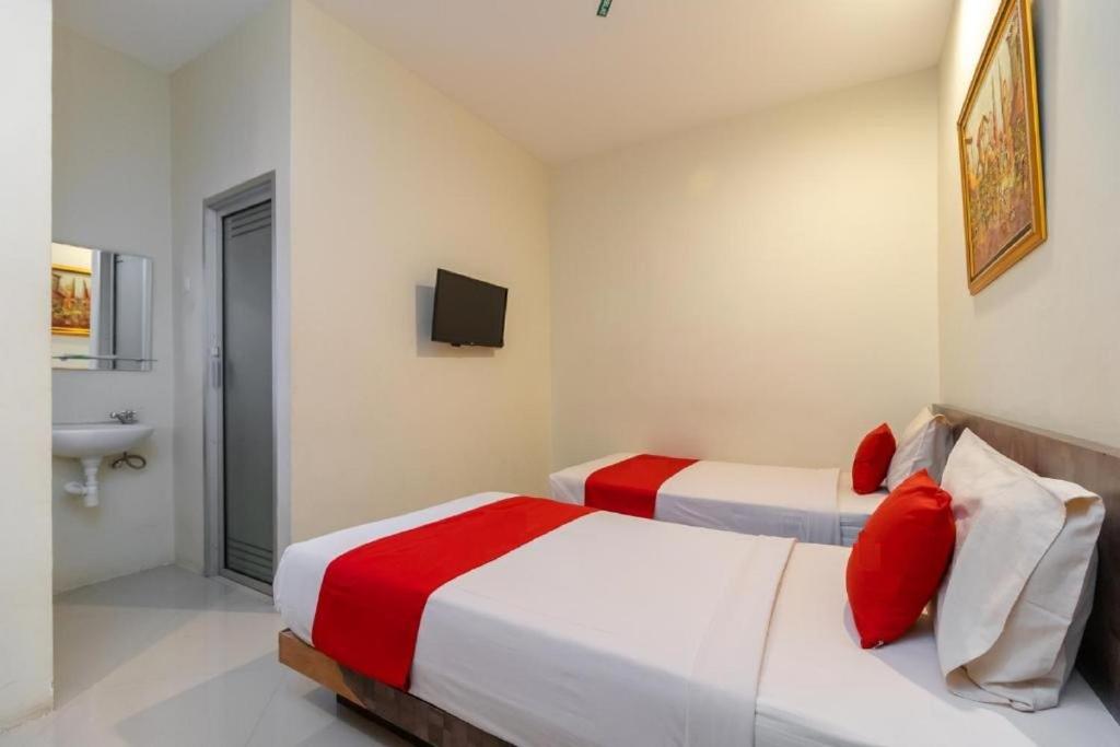 Postel nebo postele na pokoji v ubytování Hotel Domino