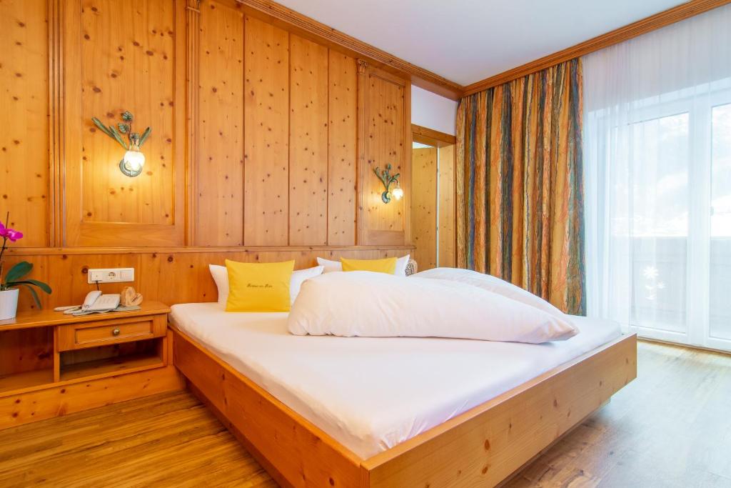 Postel nebo postele na pokoji v ubytování Pension am Rain