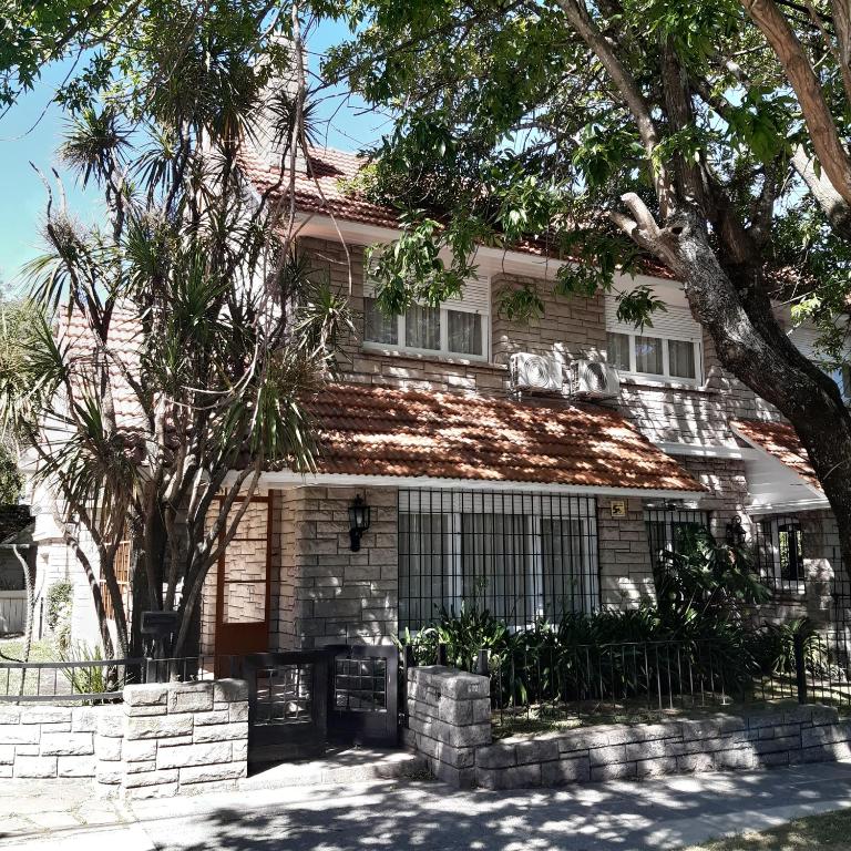 a house with a dog on the roof of it at Casa Garay 602 in Mar del Plata