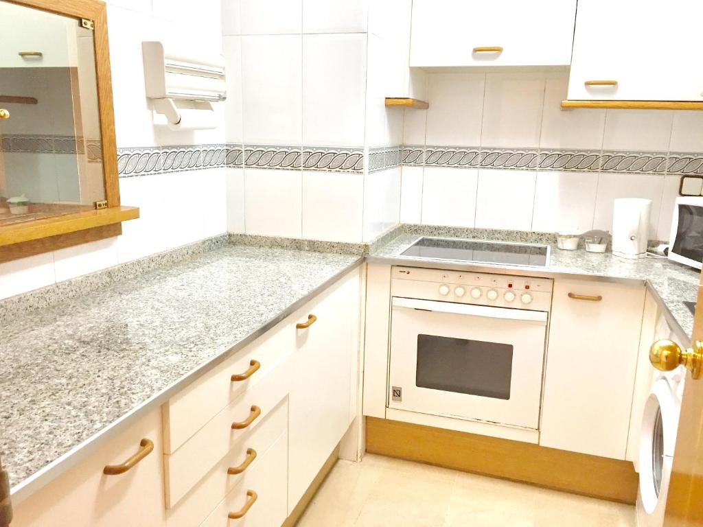 A kitchen or kitchenette at Modern Apartment in Salou - 50 m² + Pool