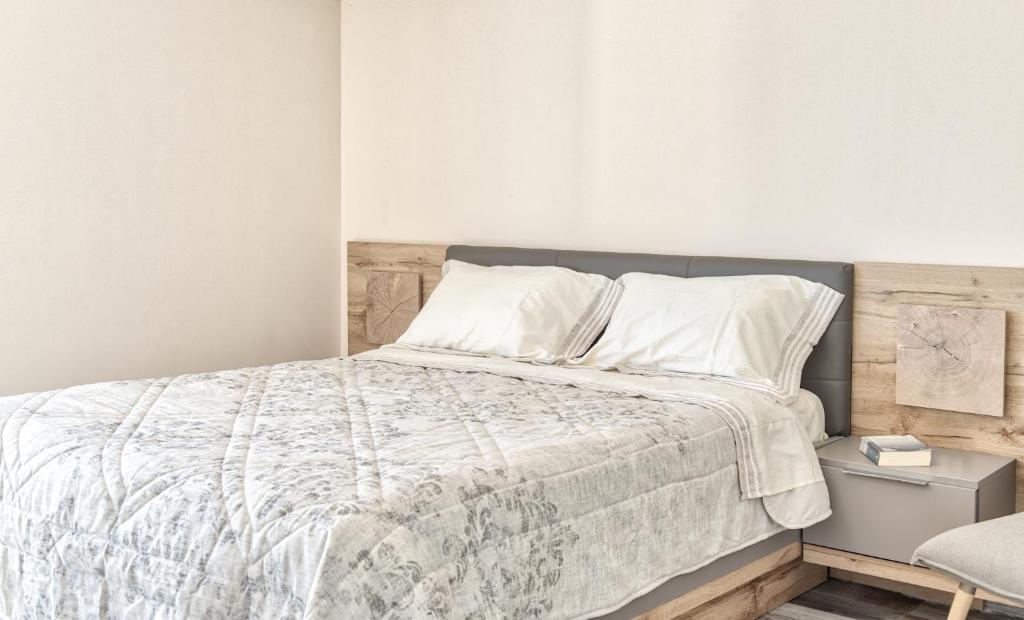 Postel nebo postele na pokoji v ubytování Mandala Seafront Suites