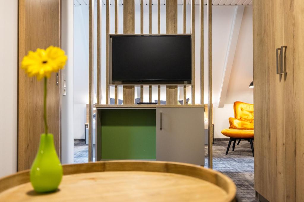 TV a/nebo společenská místnost v ubytování Pension & Café Abendröte