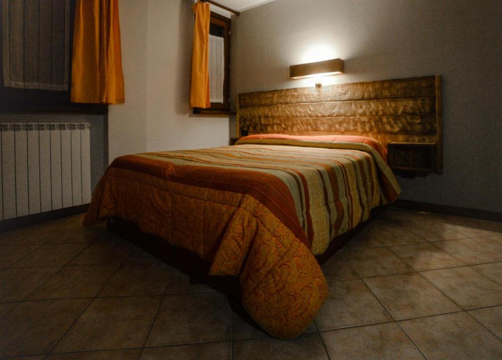 Postel nebo postele na pokoji v ubytování Chalet Della Guida