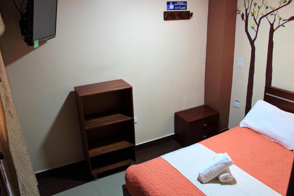 Postel nebo postele na pokoji v ubytování Hostal Dulce Amanecer