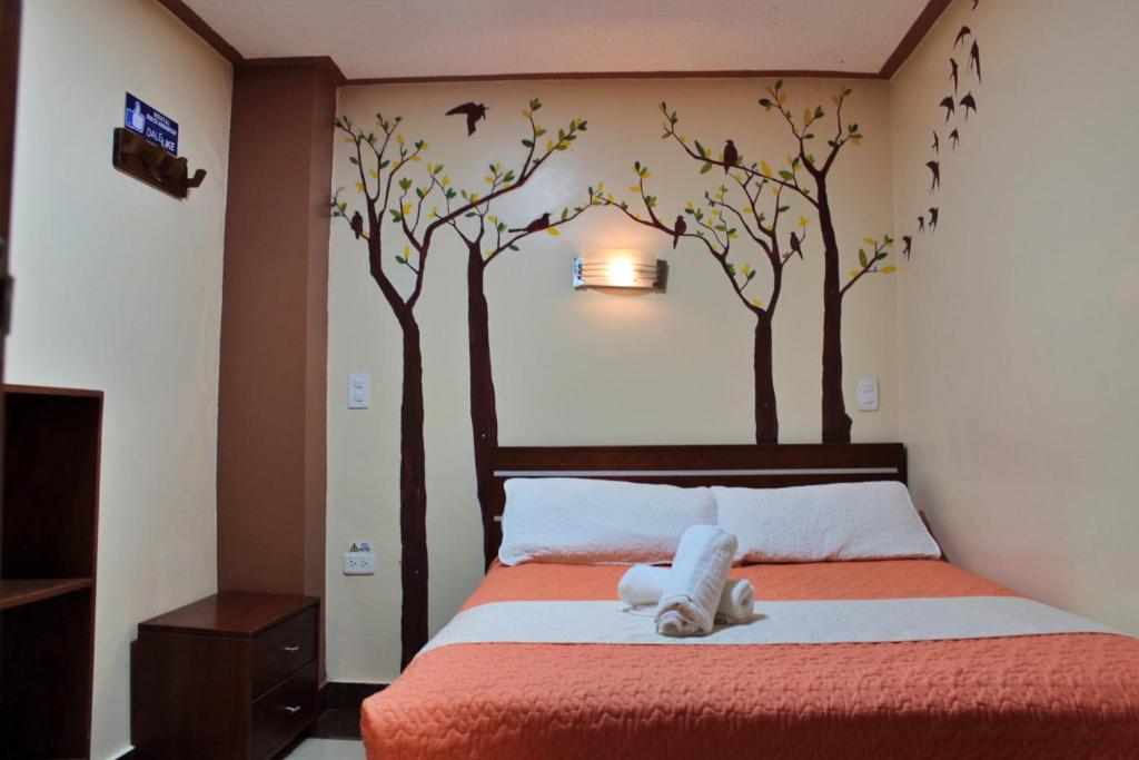 Postel nebo postele na pokoji v ubytování Hostal Dulce Amanecer