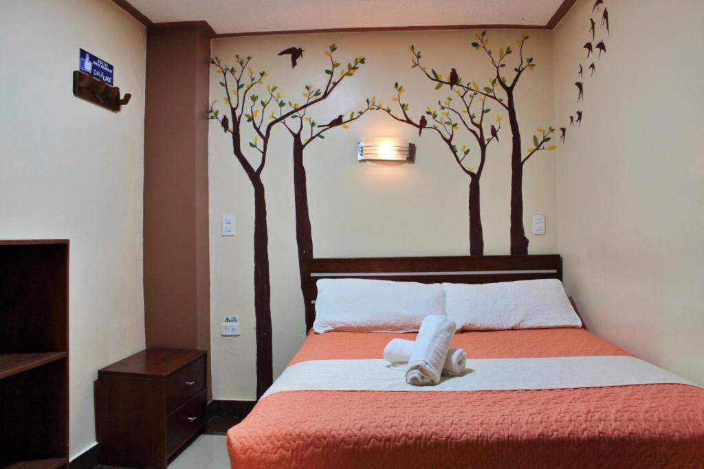 Postel nebo postele na pokoji v ubytování Hostal Dulce Amanecer