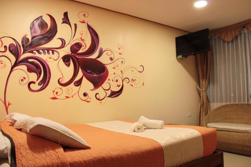 Postel nebo postele na pokoji v ubytování Hostal Dulce Amanecer
