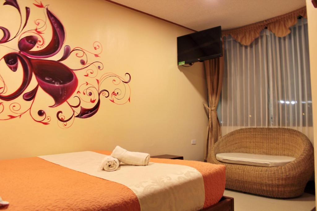 Postel nebo postele na pokoji v ubytování Hostal Dulce Amanecer