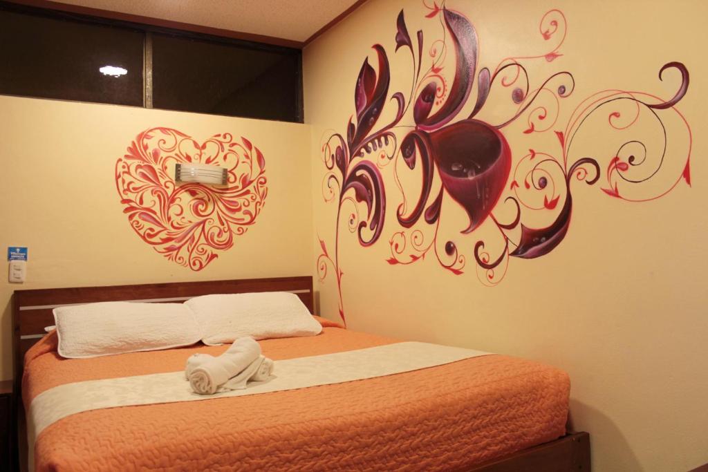 Postel nebo postele na pokoji v ubytování Hostal Dulce Amanecer