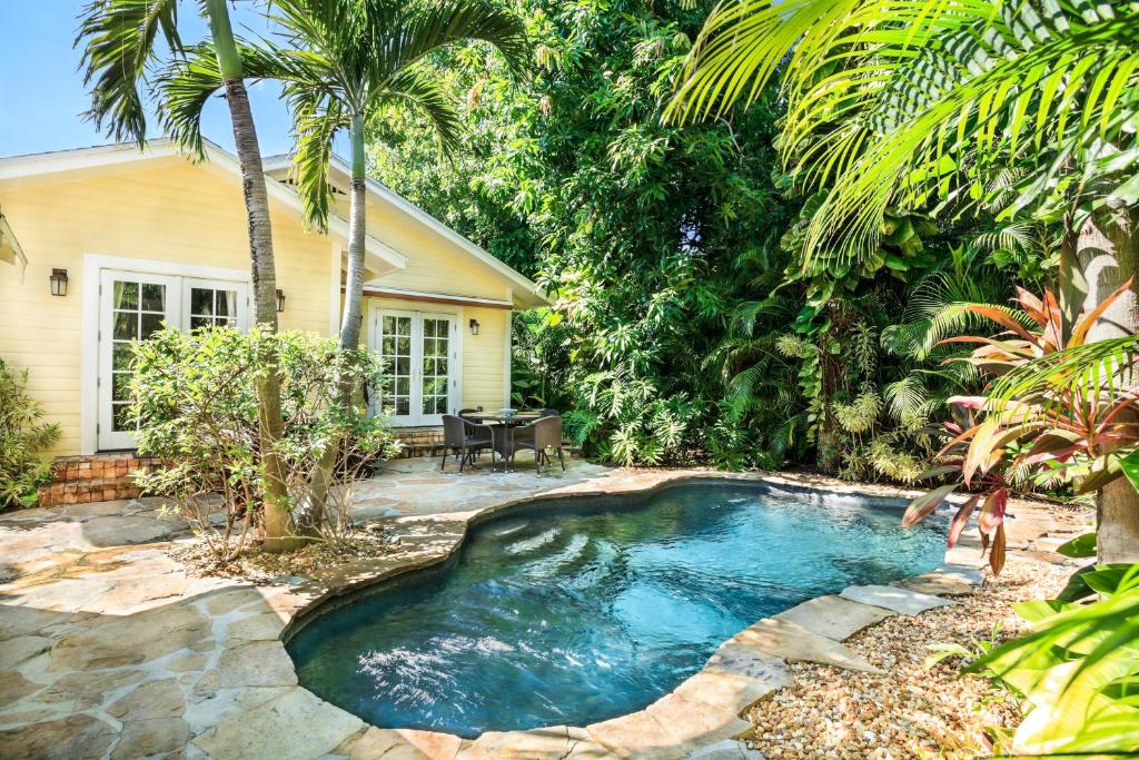 a swimming pool in the backyard of a house at Mango Haus 2bd 2ba Private Pool and Parking in West Palm Beach
