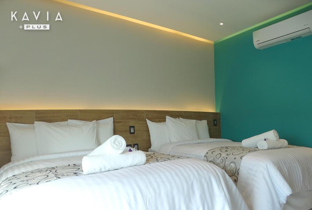 Postel nebo postele na pokoji v ubytování Hotel Kavia Plus