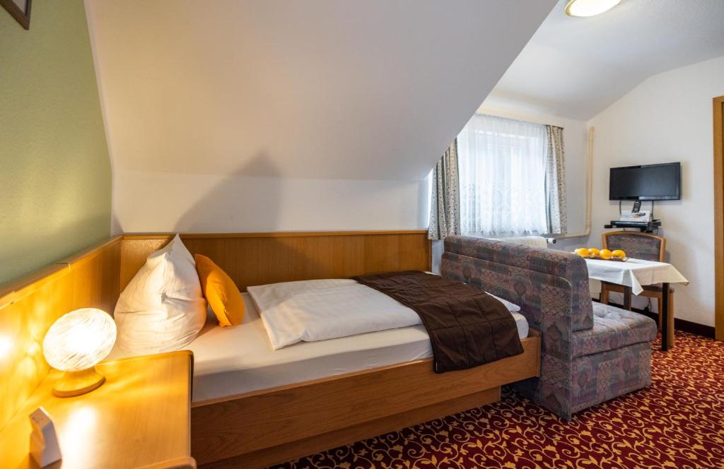 Postel nebo postele na pokoji v ubytování Pension & Café Abendröte