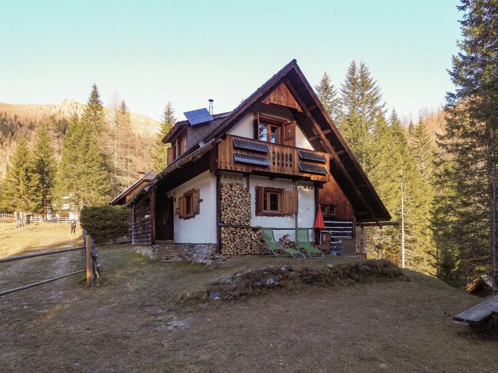 a house on top of a hill in the woods at Spacious Alpine Hut in Bad Kleinkirchheim with Garden in Bad Kleinkirchheim