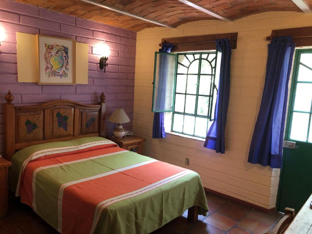 Postel nebo postele na pokoji v ubytování Casa del Retoño