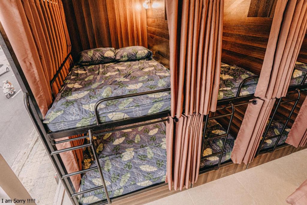 Postel nebo postele na pokoji v ubytování POSIKI Hotel & Dorm - Danang Dragon Bridge