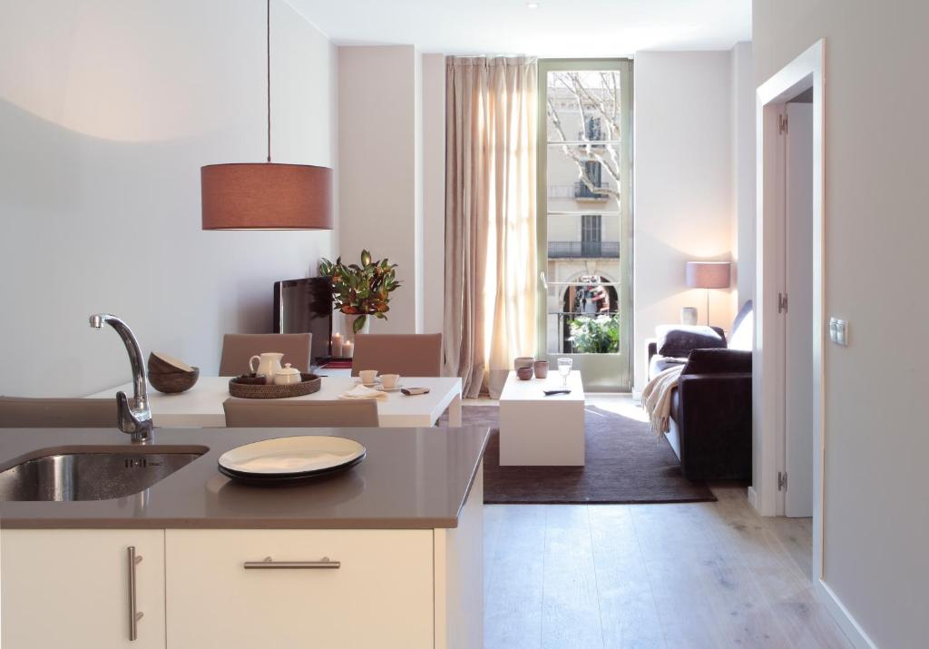a kitchen with a sink and a dishwasher at Rambla 102 in Barcelona