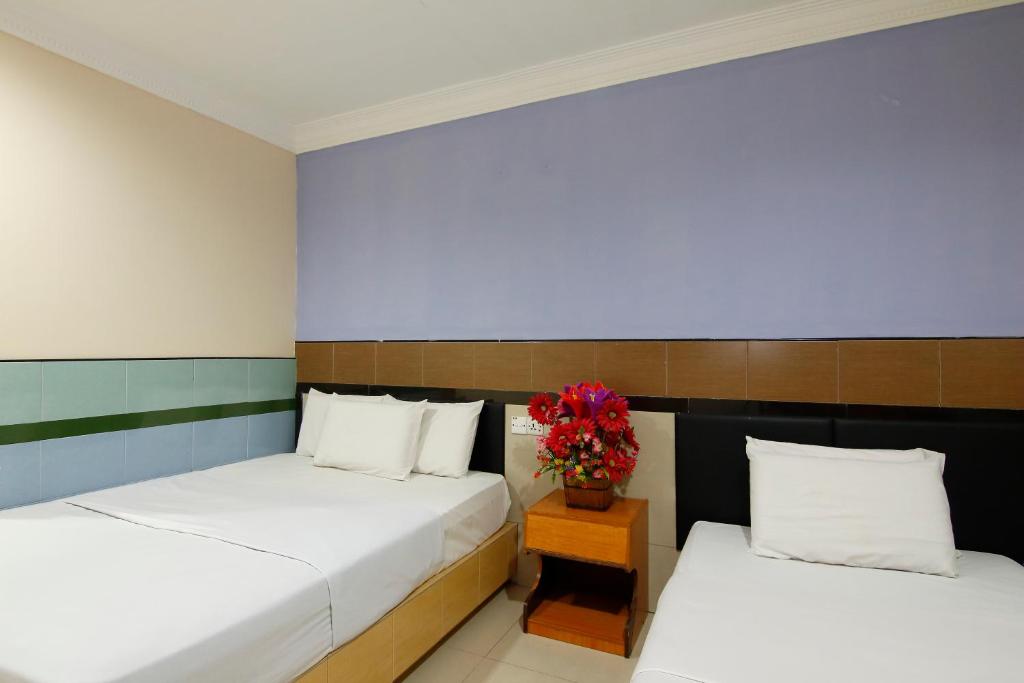 Postel nebo postele na pokoji v ubytování Cosy Inn