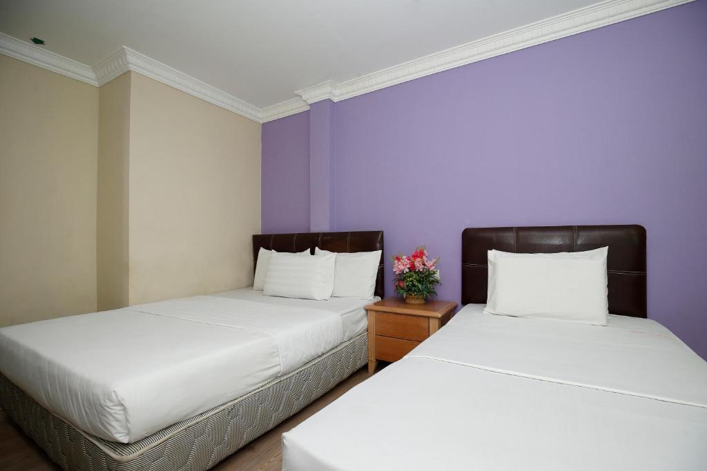 Postel nebo postele na pokoji v ubytování Cosy Inn