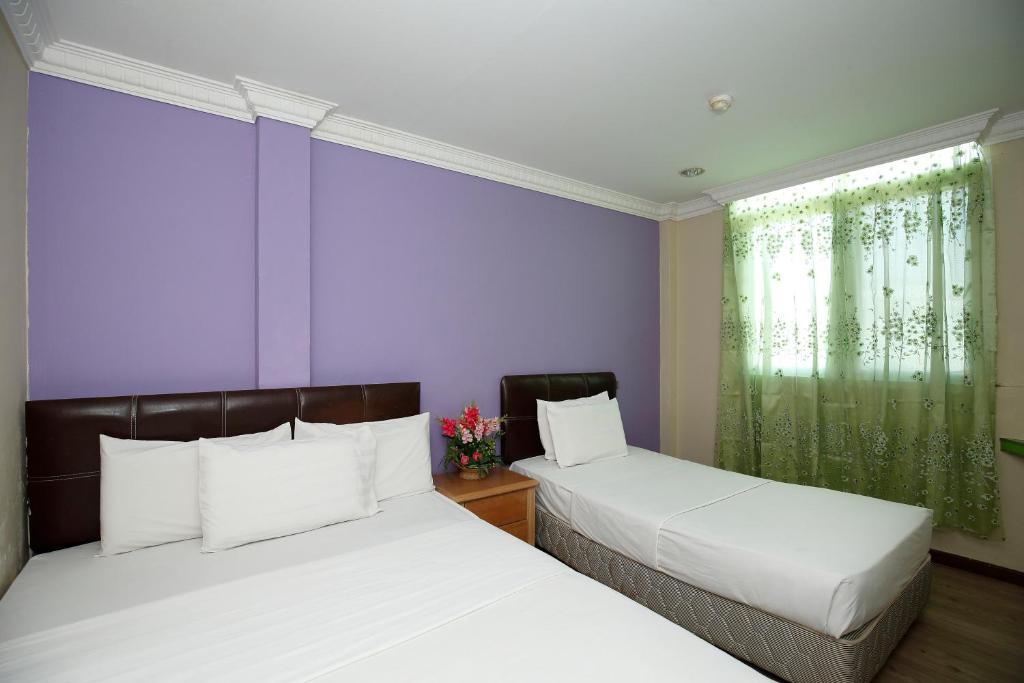 Postel nebo postele na pokoji v ubytování Cosy Inn