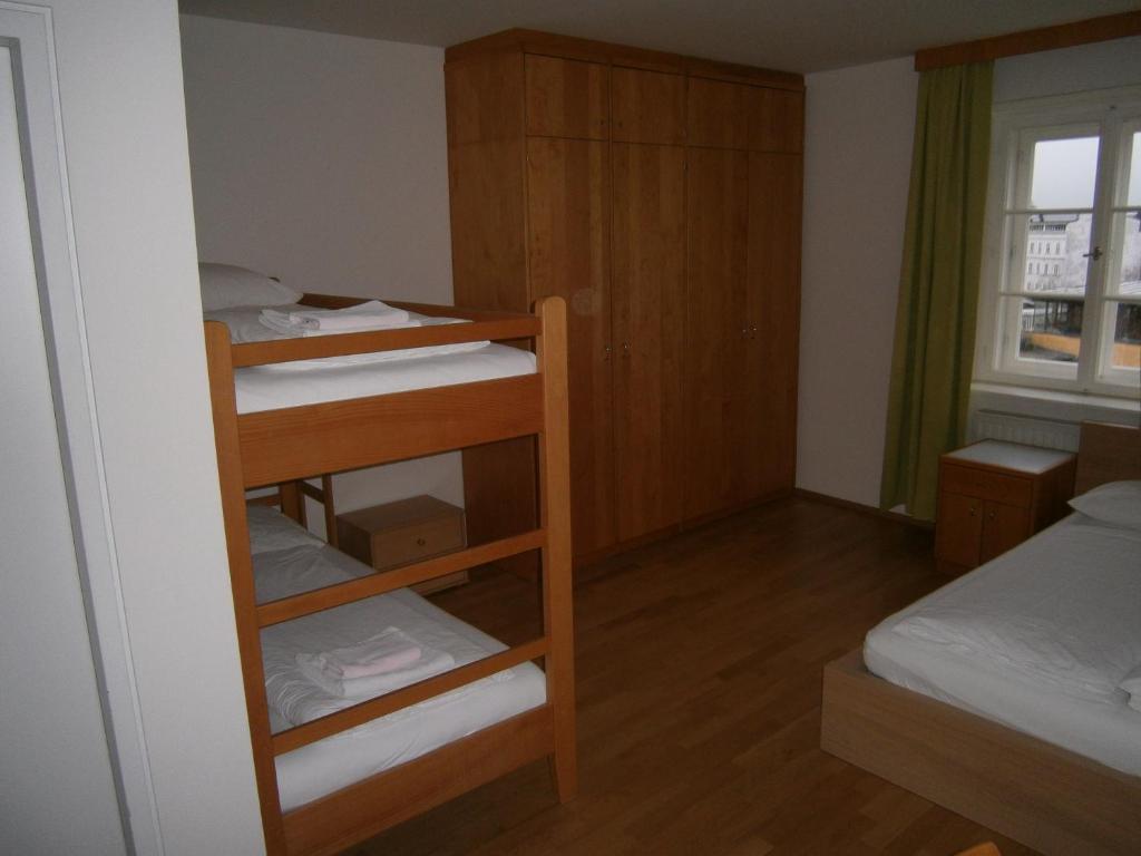 Postel nebo postele na pokoji v ubytování Institut St.Sebastian