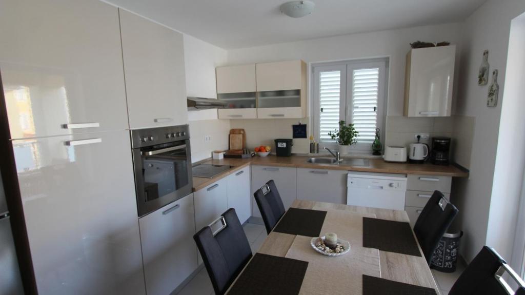 Kuchyň nebo kuchyňský kout v ubytování Apartment Lily
