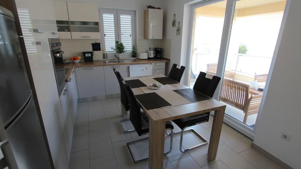 Kuchyň nebo kuchyňský kout v ubytování Apartment Lily