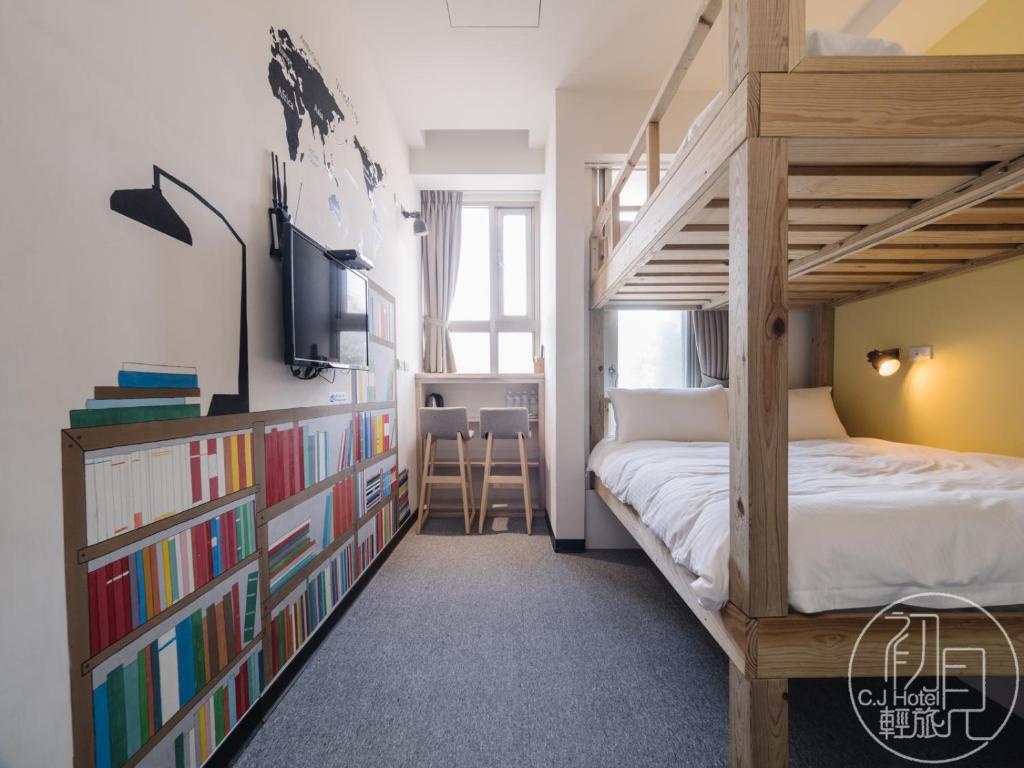 Postel nebo postele na pokoji v ubytování CJ Hotel