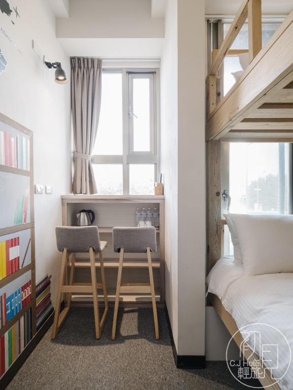Postel nebo postele na pokoji v ubytování CJ Hotel