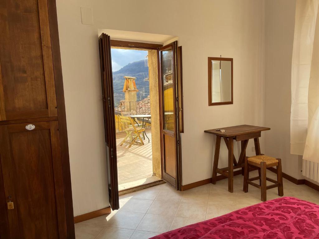 Postel nebo postele na pokoji v ubytování Ostello-Albergo dagli Elfi
