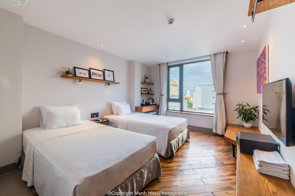 Postel nebo postele na pokoji v ubytování Mojzo Inn Boutique Hotel