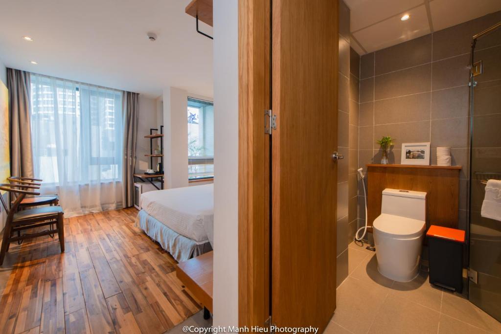 Postel nebo postele na pokoji v ubytování Mojzo Inn Boutique Hotel