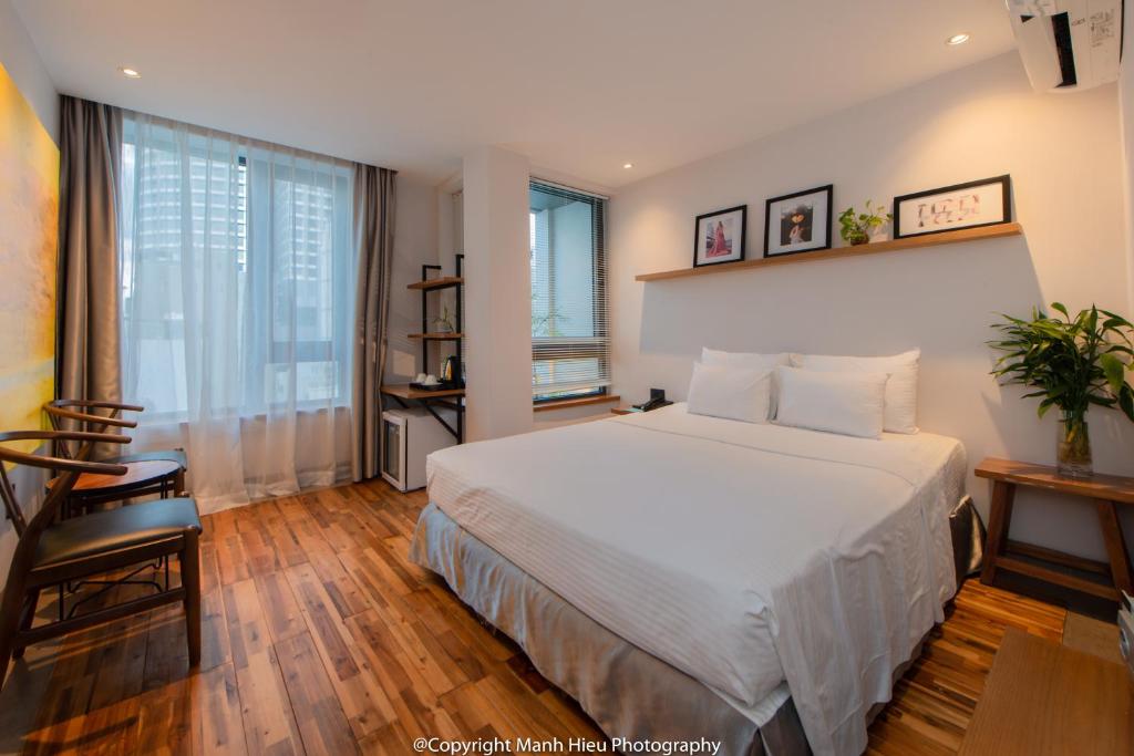 Postel nebo postele na pokoji v ubytování Mojzo Inn Boutique Hotel