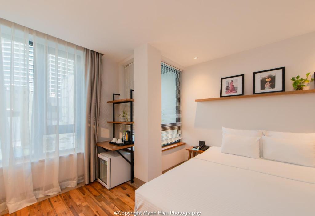 Postel nebo postele na pokoji v ubytování Mojzo Inn Boutique Hotel