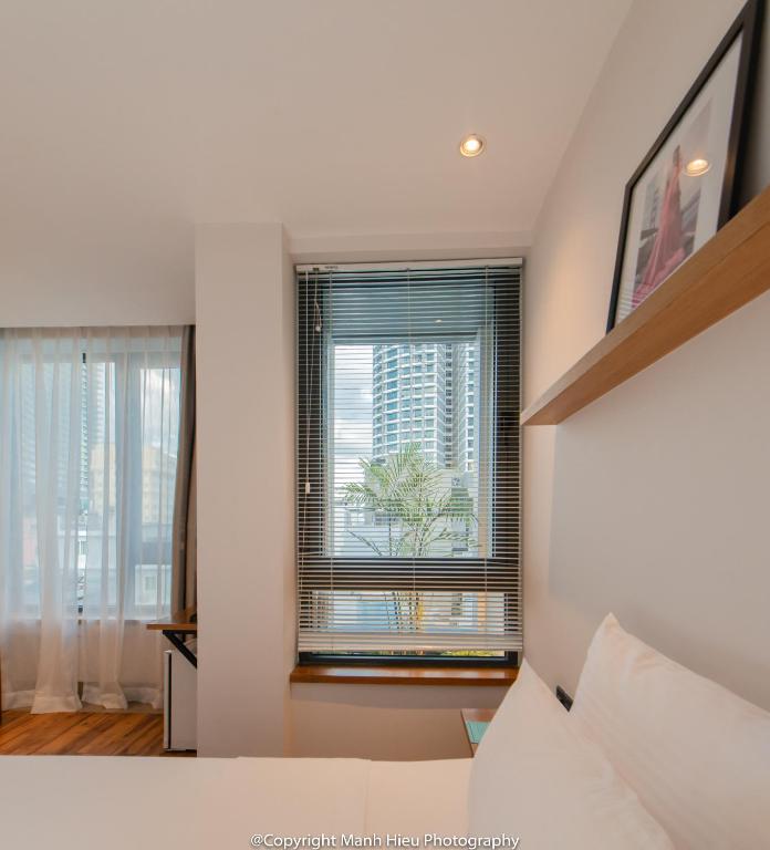 Postel nebo postele na pokoji v ubytování Mojzo Inn Boutique Hotel