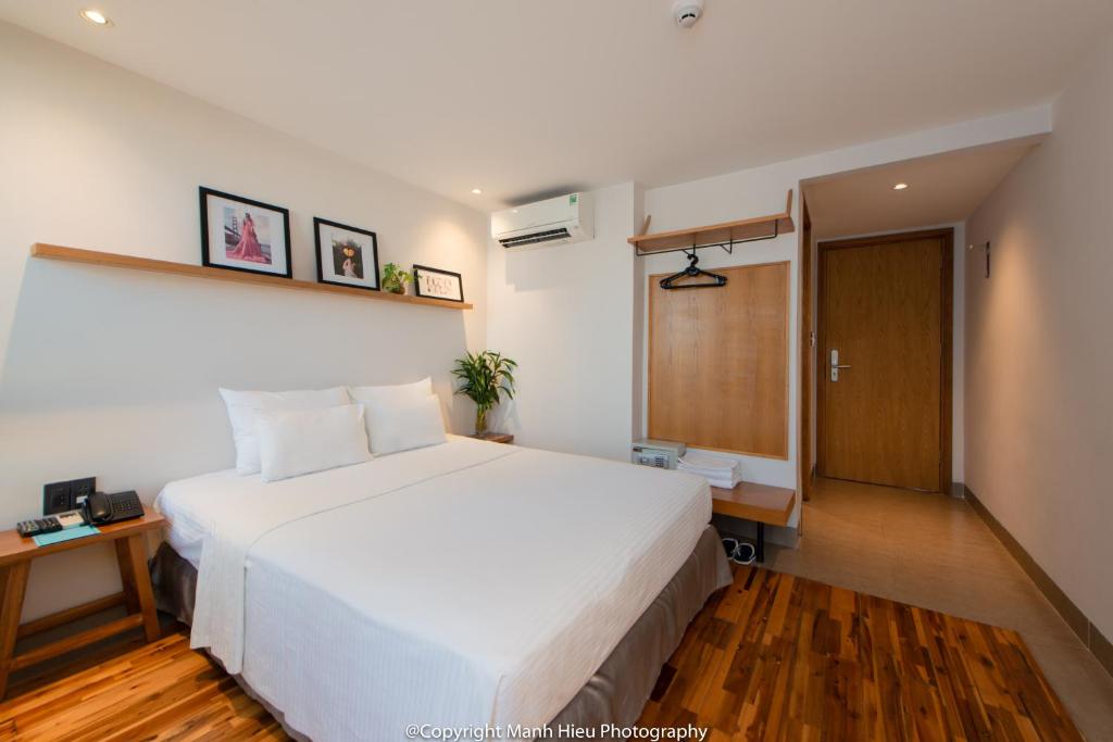 Postel nebo postele na pokoji v ubytování Mojzo Inn Boutique Hotel