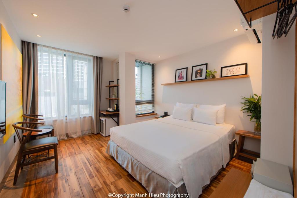 Postel nebo postele na pokoji v ubytování Mojzo Inn Boutique Hotel