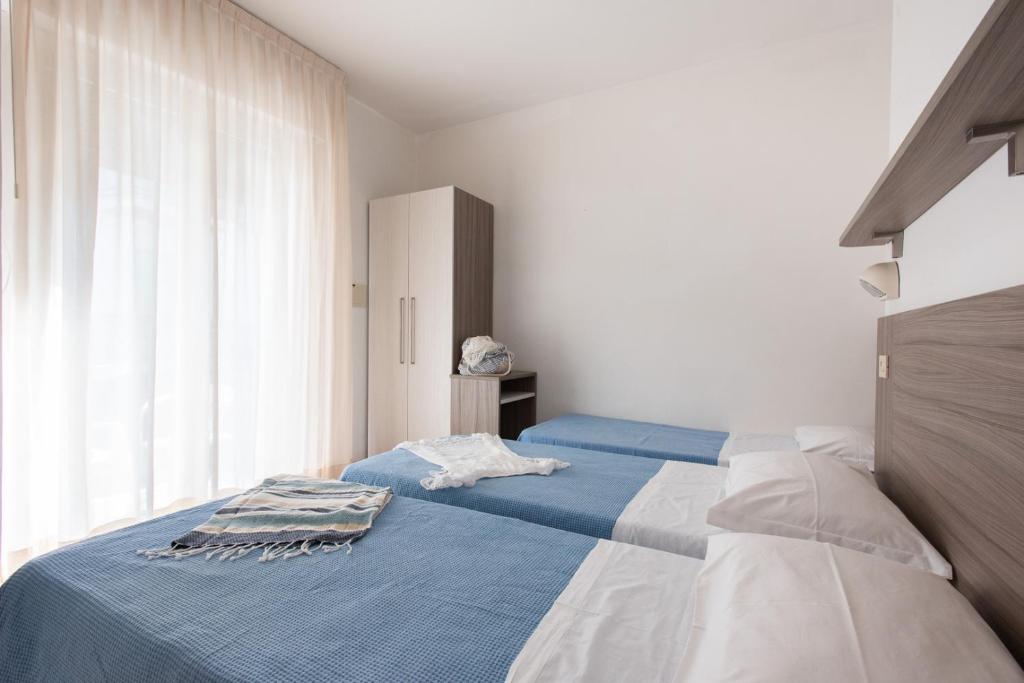 Postel nebo postele na pokoji v ubytování Hotel Consul Dipendenza la Plata con piscina