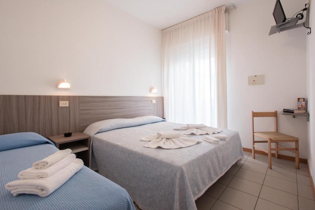 Postel nebo postele na pokoji v ubytování Hotel Consul Dipendenza la Plata con piscina