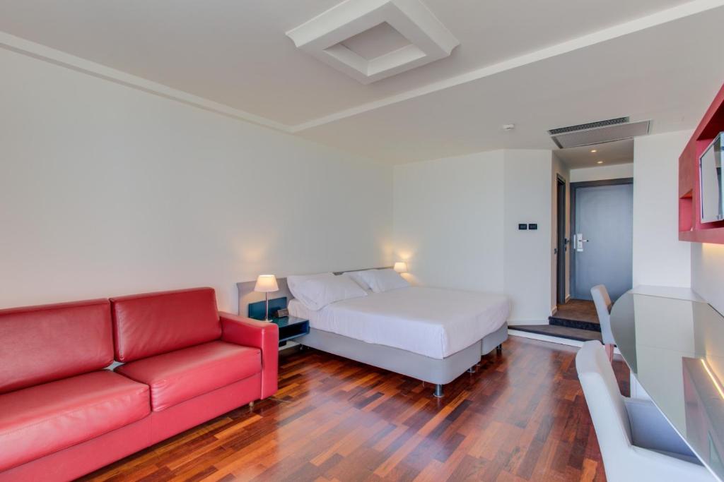 Кровать или кровати в номере Kursaal Hotel