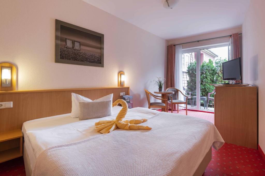 TV a/nebo společenská místnost v ubytování Pension Erdmann - Hotel Garni