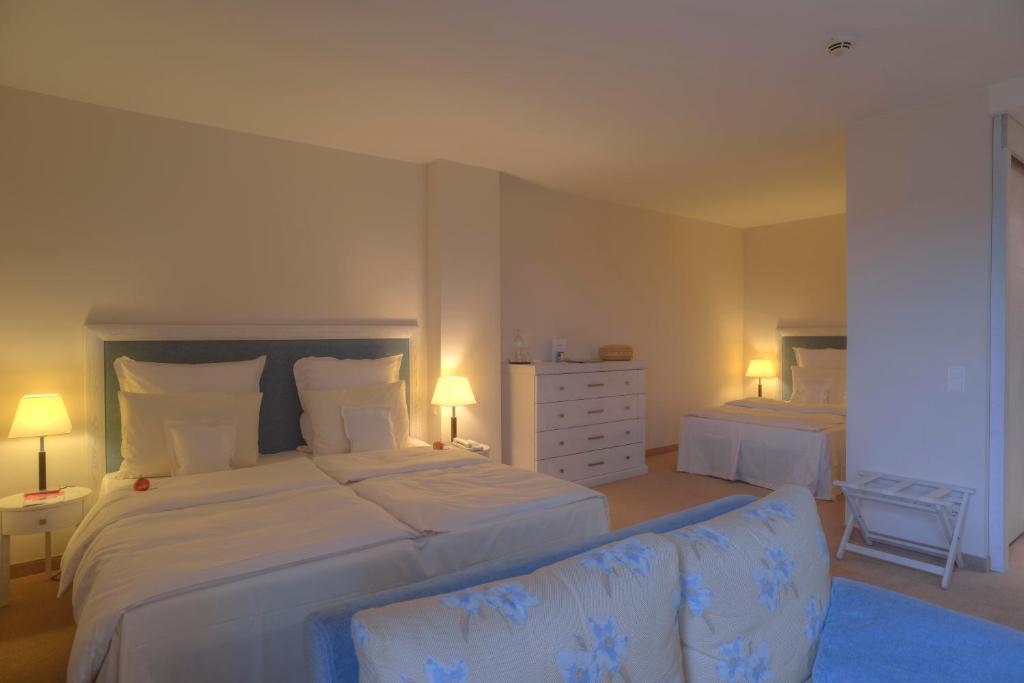 Postel nebo postele na pokoji v ubytování Strandhotel Dünenmeer - Adults only