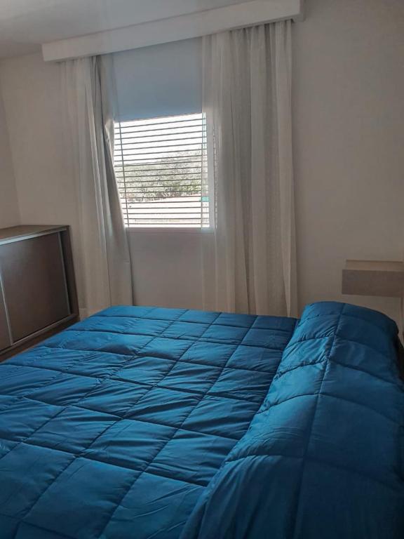 Una cama o camas en una habitación de BLU APARTMENTS